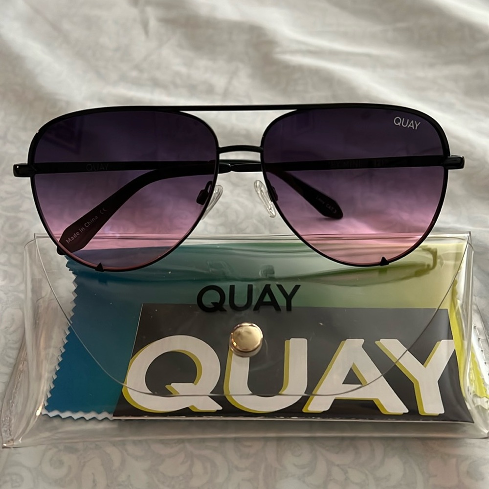 Quay sunglasses black frame with black fade to pink lenses. High key mini.